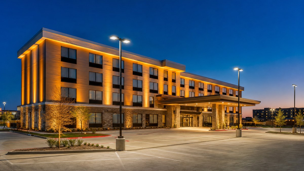 Arlington hotel exterior at dusk with programmable color-changing DMX architectural facade lighting and controlled parking lot LED lights