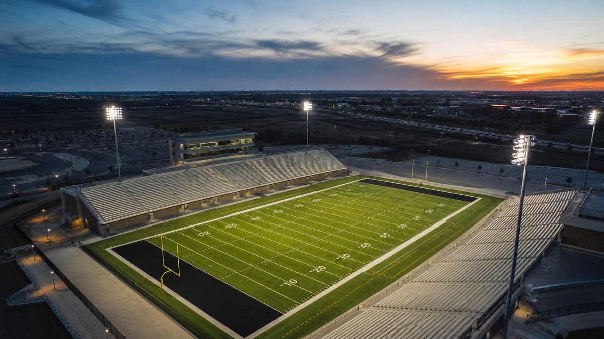 LED sports lighting on a Texas high school football field at night in the Arlington DFW area